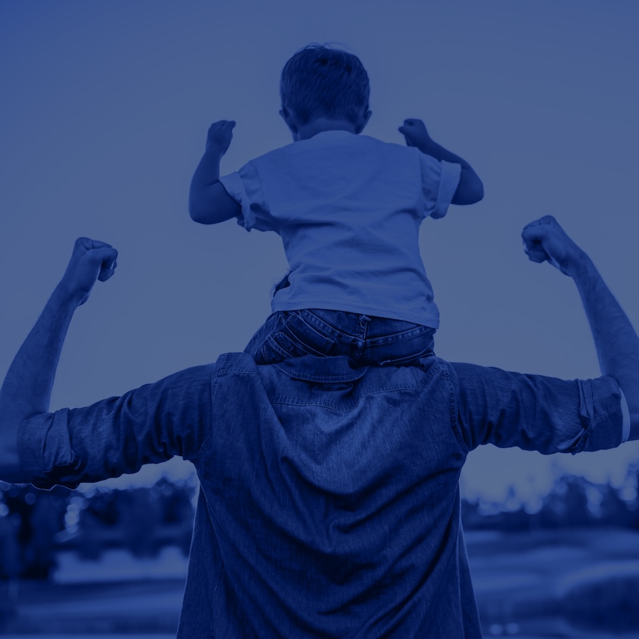 A man holding a child on his shoulders.